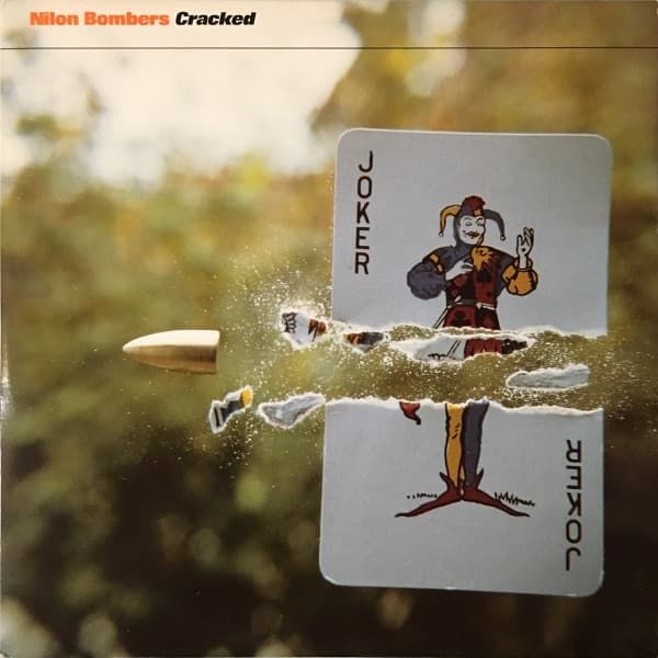 Bullet fired through joker playing card