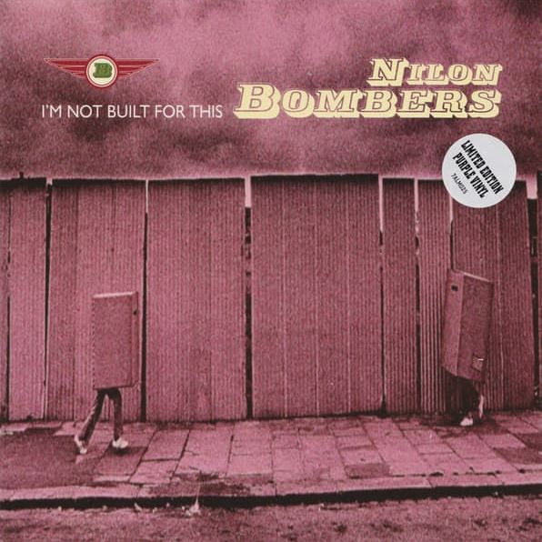 Two pairs of legs on a pavement, wearing large boxes which cover their heads and torsos.